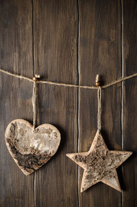 Close-up of heart shapes on wooden wall