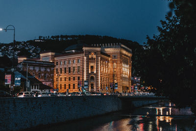 Illuminated city buildings at night