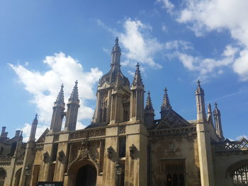 Low angle view of church against blue sky