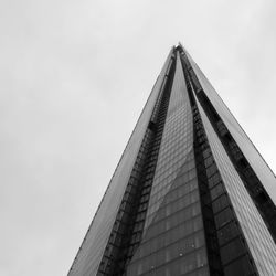 Low angle view of office building against sky