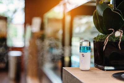 Close-up of glass bottle on table