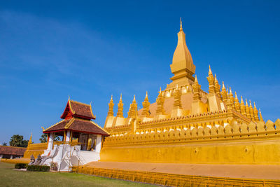 Low angle view of temple building against blue sky