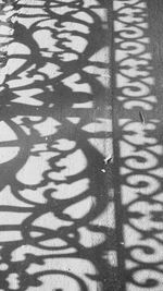 Full frame shot of shadow on tiled floor