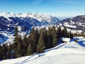 Scenic view of snow covered mountains against sky