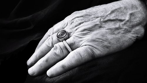 Cropped hand of person wearing rings