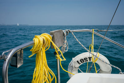 Sailboat on sea against clear sky