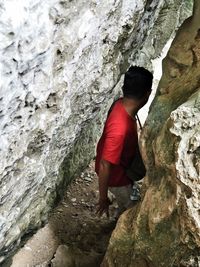 Full length of woman standing on rock