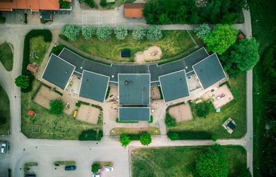 High angle view of houses and trees in yard