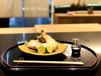 Close-up of fruits in plate on table