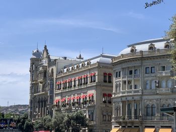 Buildings in city against sky