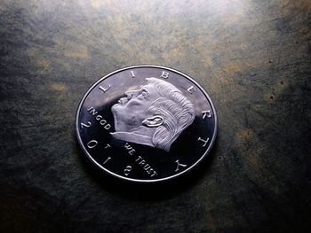 High angle view of coins on table