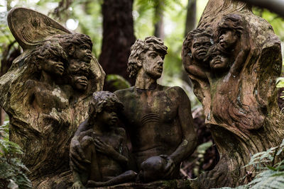 Low angle view of statue against trees