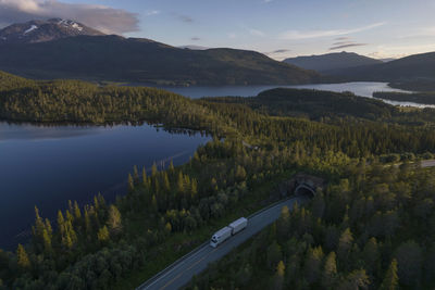 White semi truck on the scenic nordland norwegian road during midnight sun 