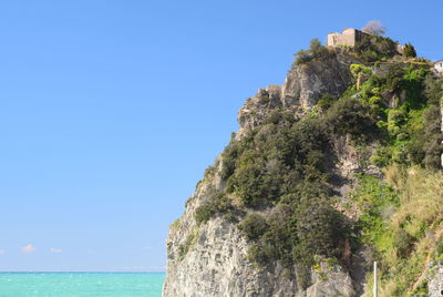 Scenic view of sea against clear blue sky