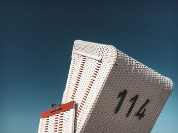 Low angle view of building against clear blue sky