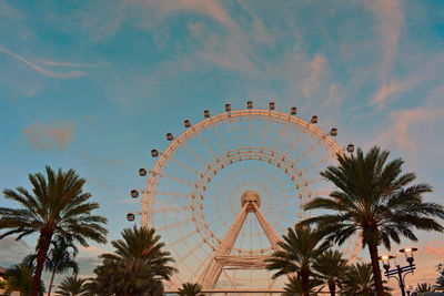 Low angle view of ferris wheel against sky