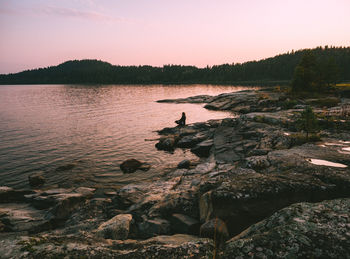 Scenic view of lake against sky during sunset