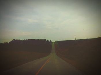 Empty road at sunset
