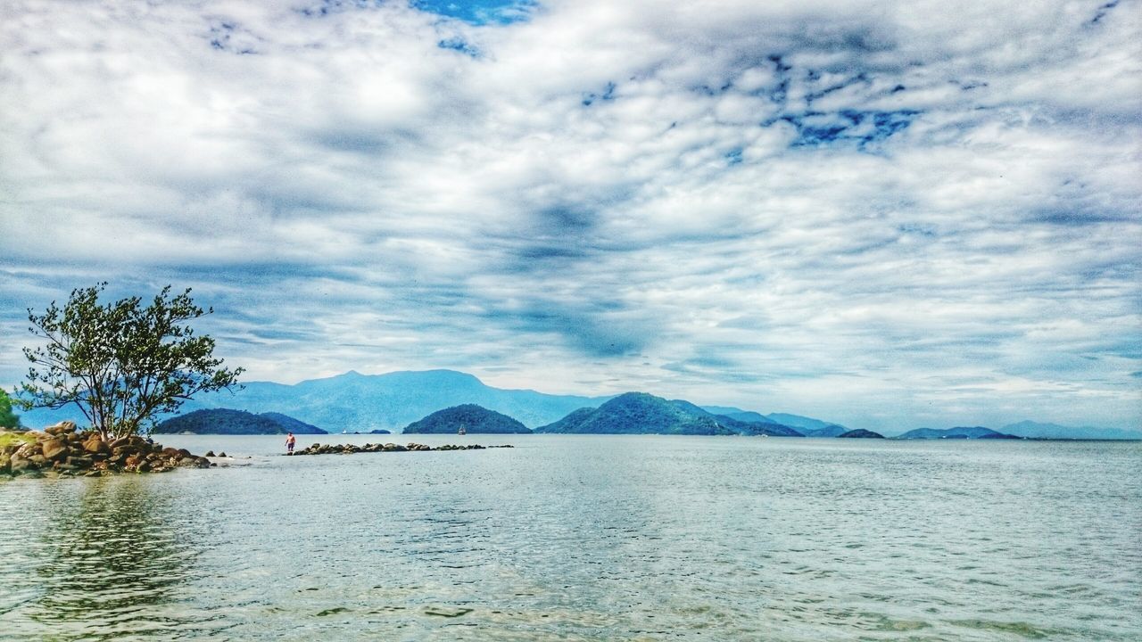 mountain, sky, water, mountain range, tranquil scene, scenics, tranquility, cloud - sky, beauty in nature, cloudy, waterfront, lake, nature, cloud, weather, idyllic, non-urban scene, rippled, sea, day