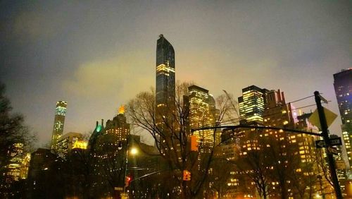 Low angle view of modern buildings at night