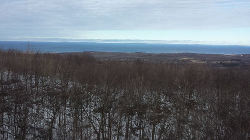 Scenic view of land against sky during winter