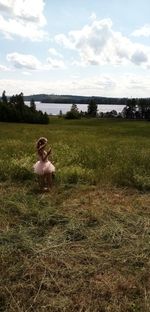 Woman sitting on field