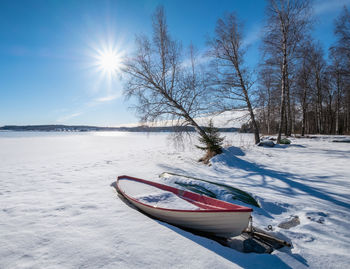 Snow on land against sky during winter