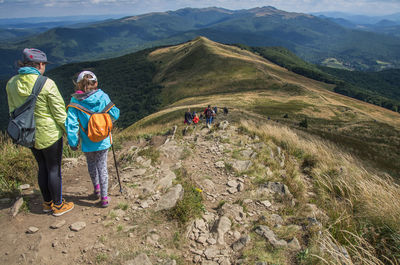 People hiking on top of mountain