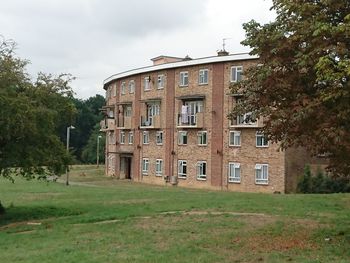 Built structure with trees in foreground