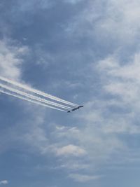 Low angle view of airplane flying in sky