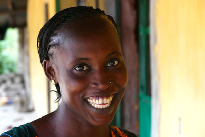 Close-up portrait of smiling young woman