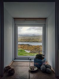 Scenic view of sea seen through home window