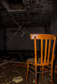 Empty chairs in abandoned building