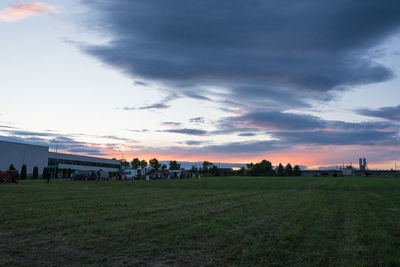 Scenic view of field against sky during sunset