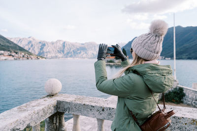 Rear view of woman looking at sea