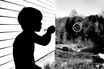 Low angle view of people against clear sky