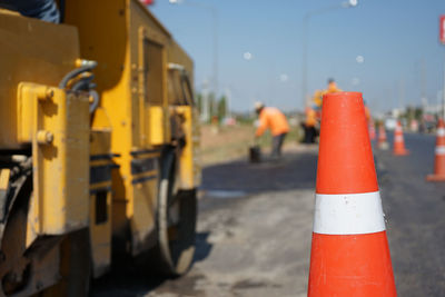 Close-up of yellow flag on city street