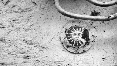 Close-up of circular object on wall
