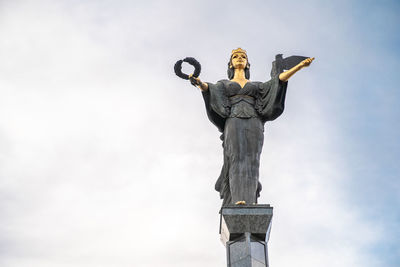 Low angle view of statue against sky