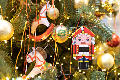 Christmas background of a christmas tree decorated with christmas toys.winter holidays. new year