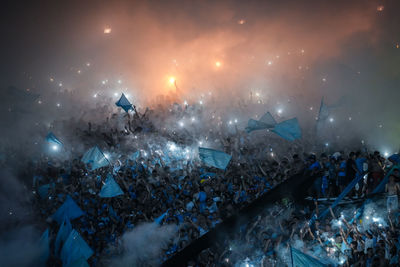 Argentine soccer fans light flares and release smoke