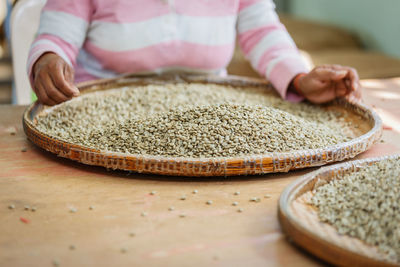 Close-up of person preparing food on table