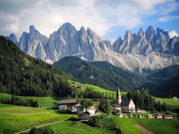 Scenic view of mountains against cloudy sky