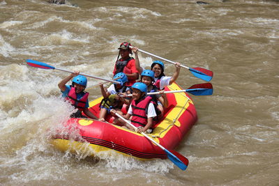 High angle view of people in boat at river