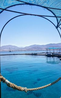 Scenic view of calm sea against blue sky