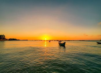 Scenic view of sea against sky during sunset