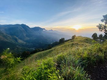 Scenic view of landscape against sky during sunset