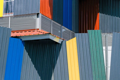 Low angle view of multi colored steel cladding to building