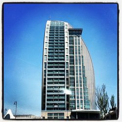 Low angle view of modern building against clear sky