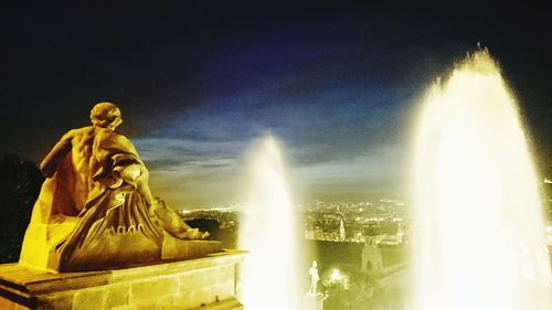 Low angle view of statue at night